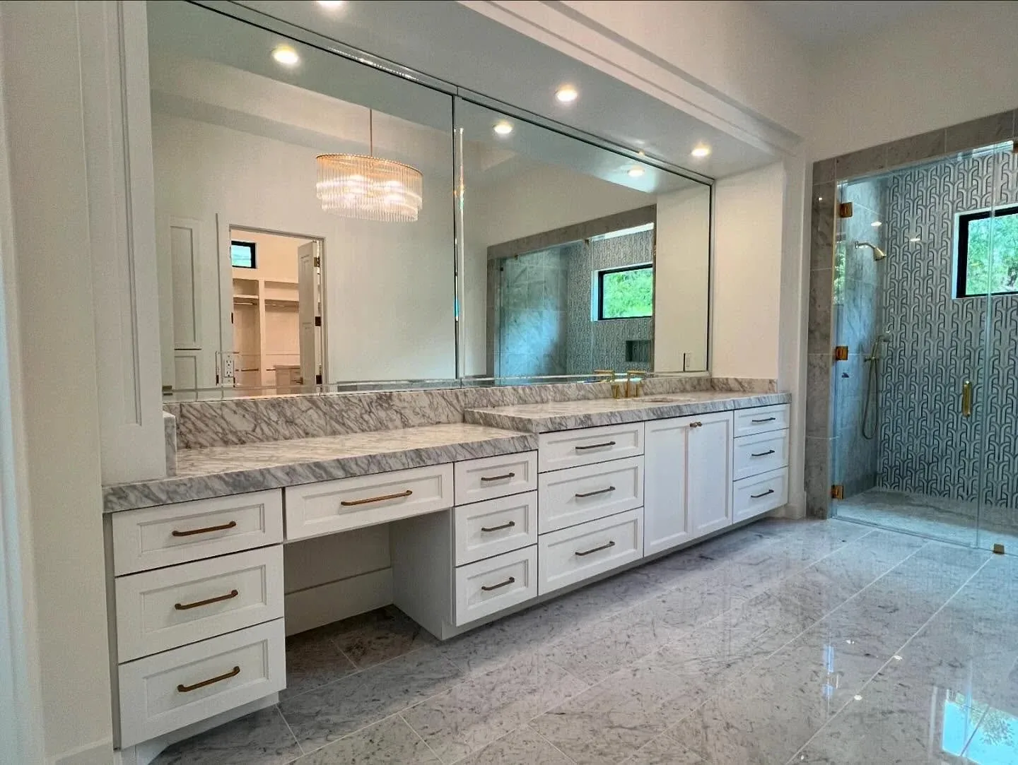 White double vanity with a stone countertop