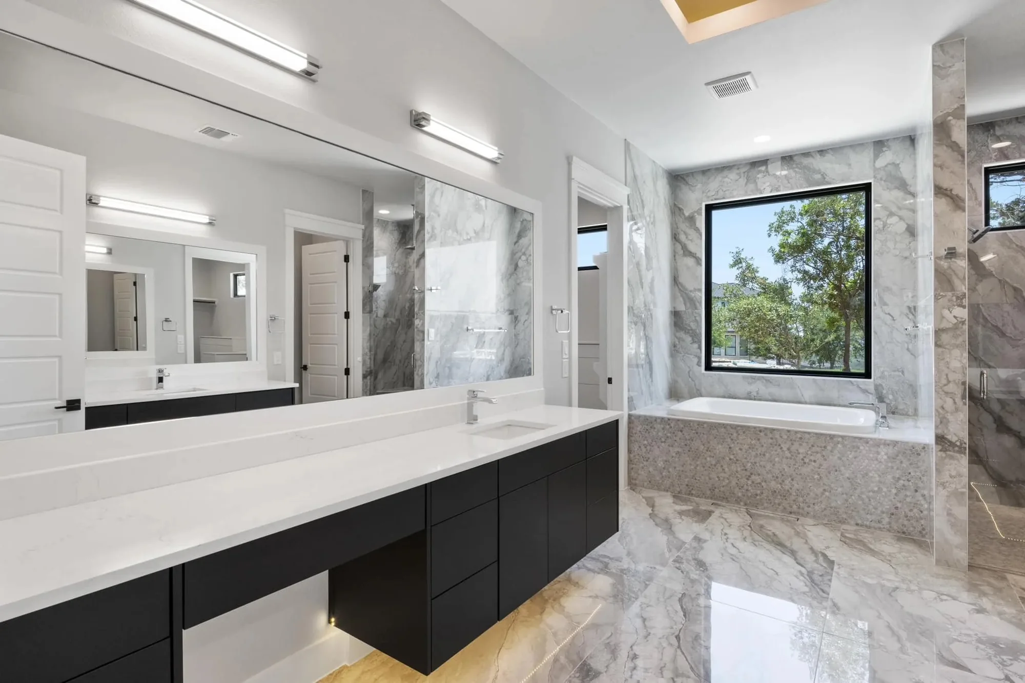 Floating bathroom vanity with a marble surround